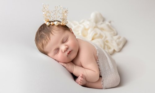 Newborn Photography Blog | Blossom Brook Studio 597 Beautiful newborn baby sleeping peacefully with a delicate crown, captured at Blossom Brook Studio – Newborn Photography Sydney.