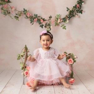 baby one year old photoshoot in sydney baby girl pink wooden floor