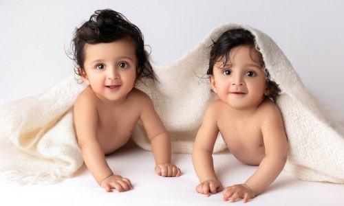 Newborn Photography Blog | Blossom Brook Studio 602 Adorable twin babies under a blanket captured during a professional baby photography Sydney session at Blossom Brook Studio.