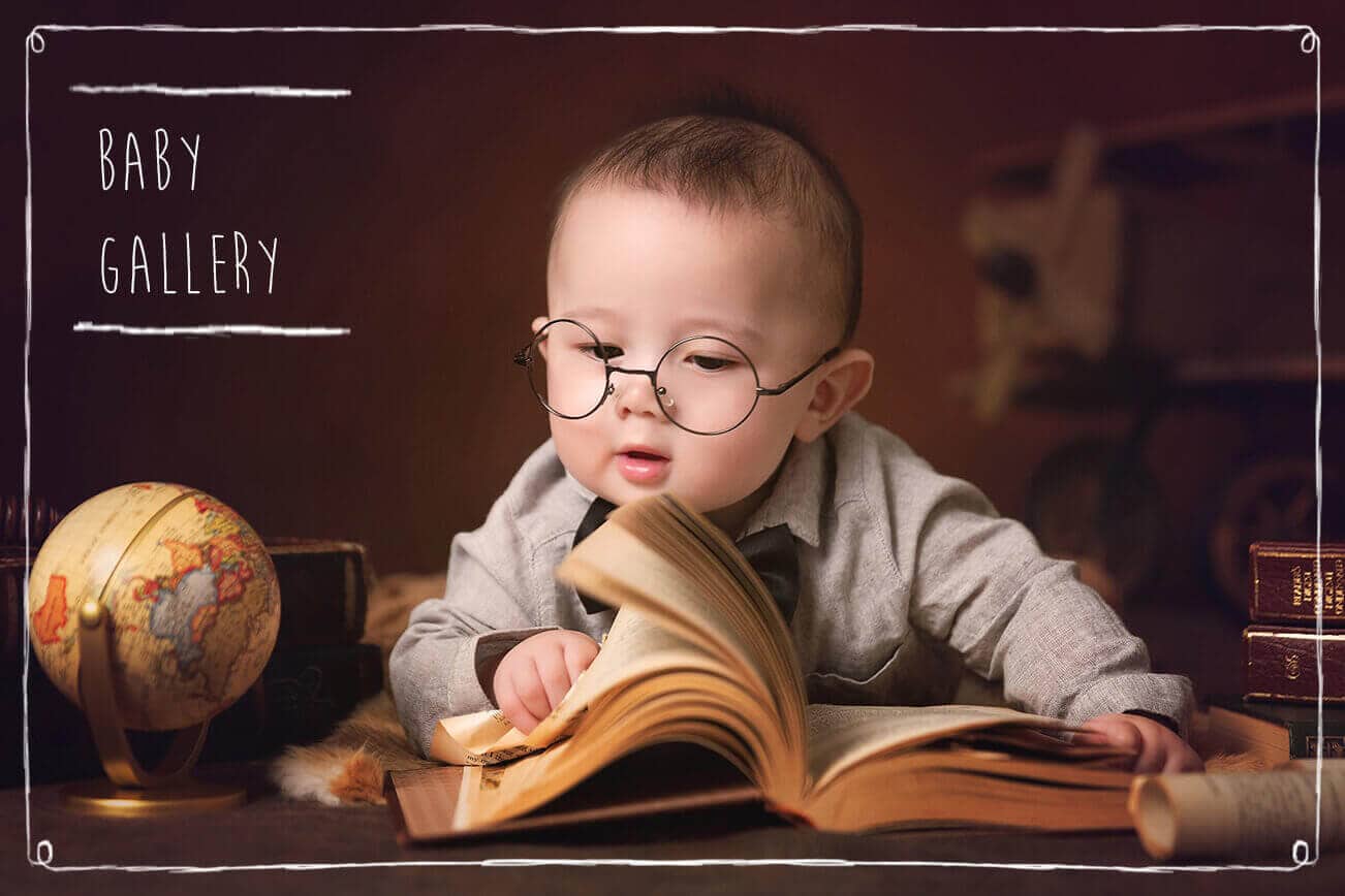 baby wearing glasses read a book