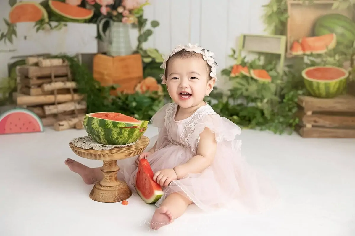 baby photoshoot with watermelon smash theme baby girl laughing