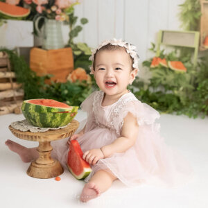 baby photoshoot with watermelon smash theme baby girl laughing