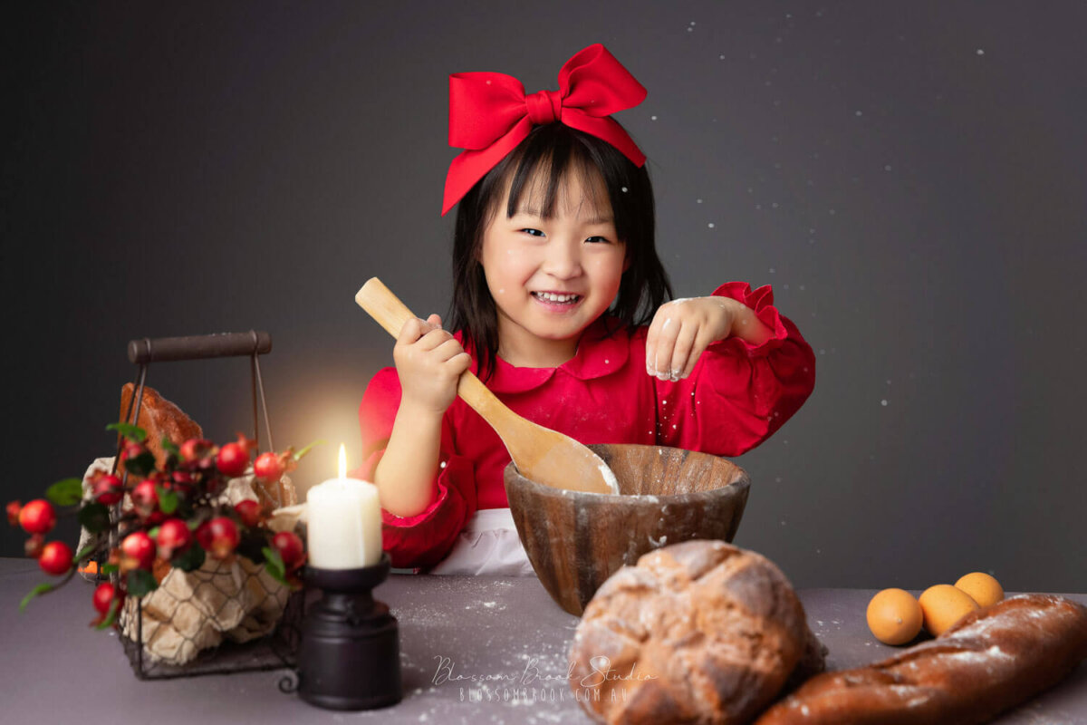 kids photography girl in red dress playing flour
