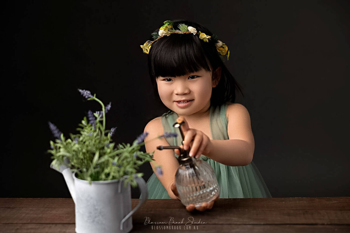 children photography girl watering flower laughing