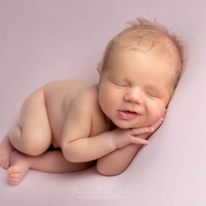 newborn baby smile pink