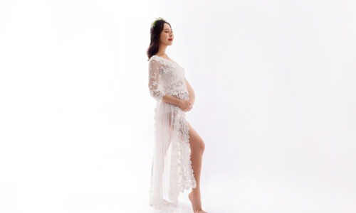 pregnant lady in white dress pregnancy shoot